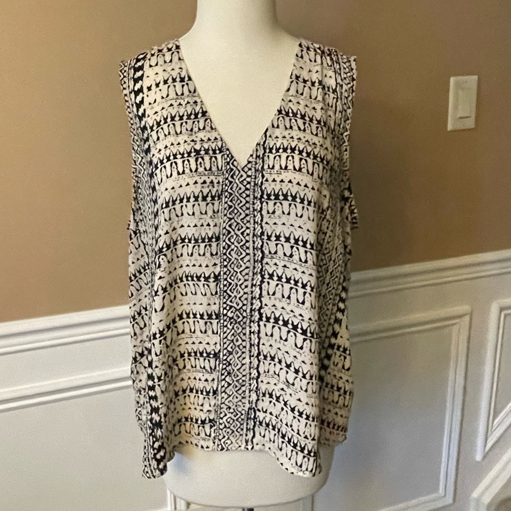 Cream and black patterned sleeveless blouse